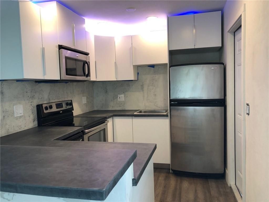 Photo of 1298 NE 33rd St #A, Oakland Park, FL 33334 (MLS # F10377576)