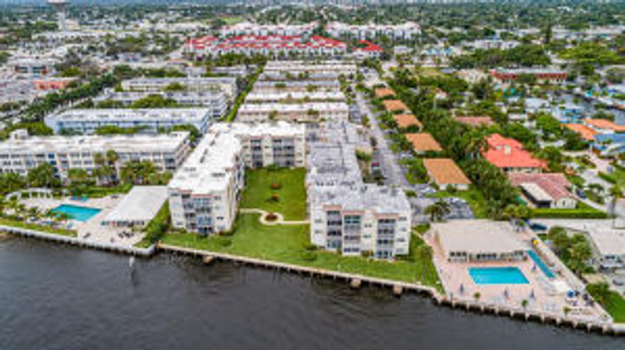 Enjoy a Waterfront Lifestyle with Intracoastal Waterway views from immaculately maintained Sung Harbor Gardens. Endless boat watching from your living area, patio, bedroom and pool. Wonderful Florida sunrises. Updated 2 bedroom, 2 bath Condo. All assessment  paid. Recently Renovated, Newer A/C & Appliances, Impact Windows, New Waterfront Pool, New Seawall. Structural studies completed. A well run active adult 55+ community located in the "Village" like downtown of Boynton Beach. Walk to Publix, Banking, Dinning, Walgreens, to the Intracoastal Bridge and more, much more. Available Furnished. Views to manicured gardens and the Intracoastal waterway. Parking close to unit. 308 is close to elevator, laundry and stairs, Parking right there. Lease Ok w Restrictions.