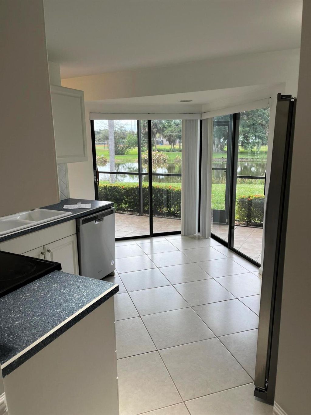 Photo of 7 Lexington Lane E #A, Palm Beach Gardens, FL 33418 (MLS # R11062201)