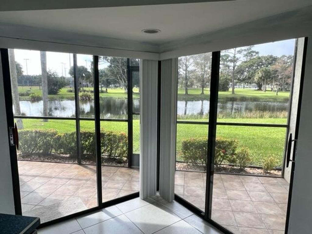 Photo of 7 Lexington Lane E #A, Palm Beach Gardens, FL 33418 (MLS # R11062201)