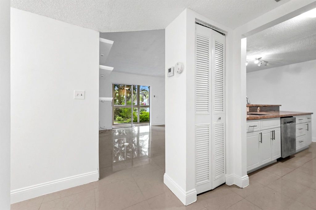 Photo of 5190 E Sabal Palm Boulevard #104, Tamarac, FL 33319 (MLS # R11146729)