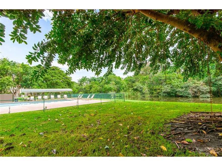 Updated 4th floor 2 bedroom 2 bath unit.  Faces the pool, canal, and the park.  New kitchen, new flooring, updated bathrooms, impact windows, new appliances, complete with a washer and dryer in the unit.