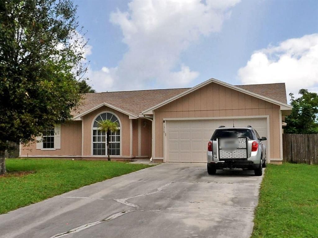 Photo of 1319 SE Naples Lane Ln, Port St Lucie, FL 34983 (MLS # R10731489)