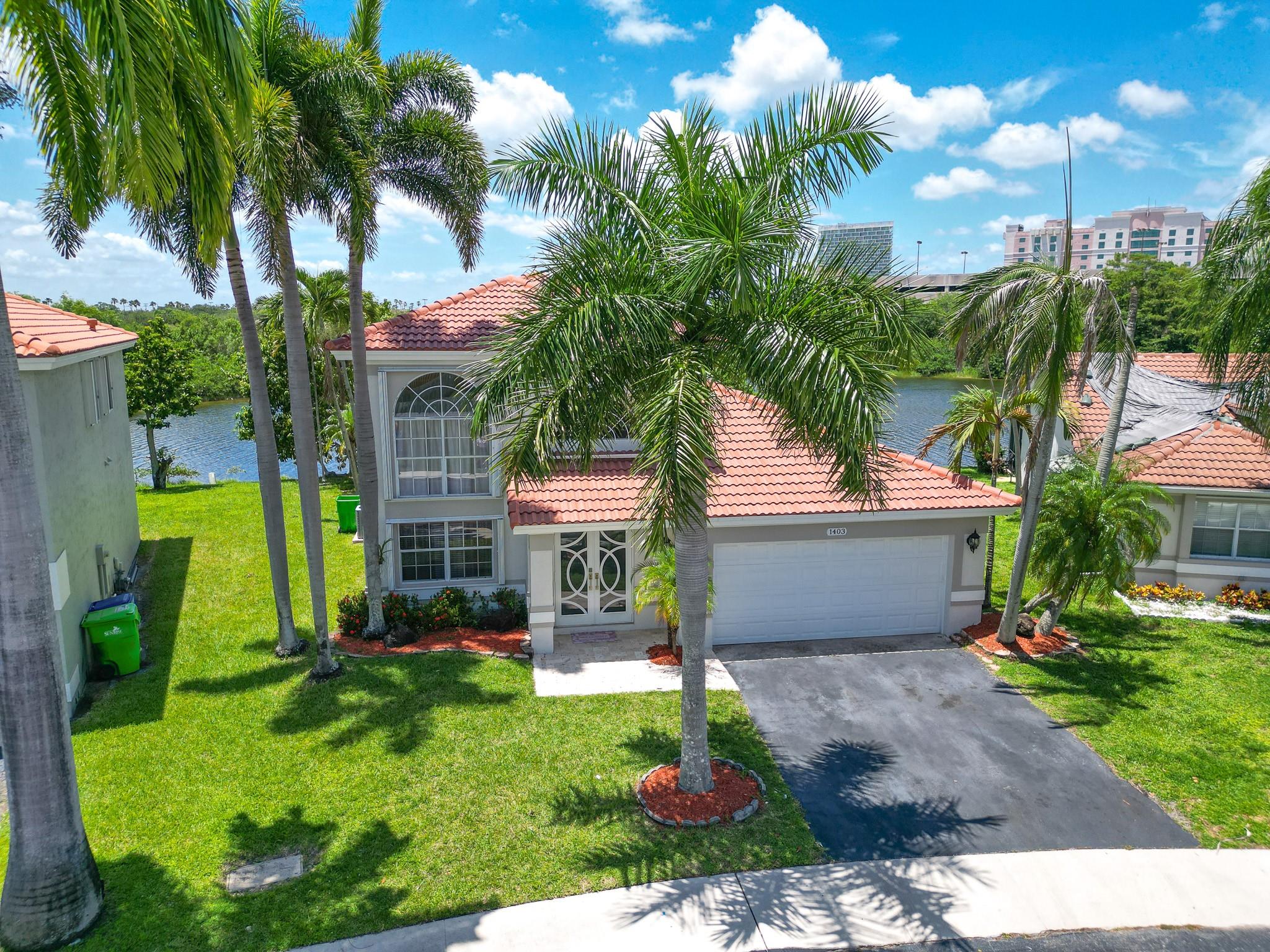 Stunning move-in-ready 3/2.5 LAKEFRONT-POOL home, 2-story home w/Master bdrm on 1st floor, features BRAND-NEW 30+YEARS TILE ROOF, NEW IMPACT DOORS, newer gas STAINLESS STEEL appliances, newer KITCHEN w/wood cabinets, pantry, Quartz counter, walking closets, 24x24inch tile, 2020-A/C, 2022-Diamond-Brite POOL w/color lighting, laminate upstairs floors, private fenced backyard, 2-car garage & Volume ceilings. In desirable Sawgrass Mills community across from Sawgrass Mall which is well-known for exquisite dinning/shopping & entertainment. Next to Flamingo Park offering great amenities like Bike Station/ Soccer/Softball/Splash Pad/playground/T-ball/Tennis/Walking/running Path/outdoor gym. Yard is great for entertaining, multiple fruit trees/near I-75/I-595, Turnpike/Sawgrass Expy. Pet friendly.