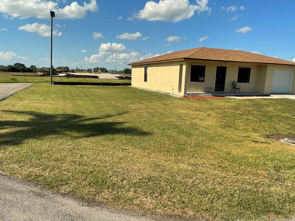 Photo of 920 NW 4th Street, South Bay, FL 33493 (MLS # R10986741)