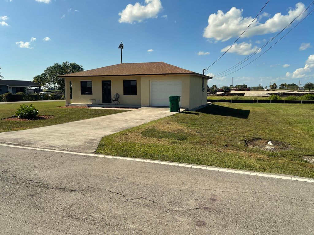 Photo of 920 NW 4th Street, South Bay, FL 33493 (MLS # R10986741)