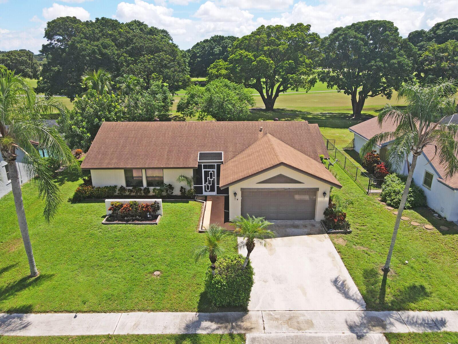 Incredible VALUE! Superb views are seen from this 'RARE'' 3-bedroom, 2-bath, 2-car garage, PLUS BONUS ROOM DEN/OFFICE, (can easily become a 4th BEDROOM by adding a closet) one-story single-family home directly on the Palm Beach County Southwinds Golf course. Large and private backyard with a covered and screened patio almost the full width of the home! The roof just five years new, a/c less than 1 year and upgraded kitchen cabinets with solid surface countertops. Living areas are fully tiled! INCREDIBLY LOW HOA just $75 MONTHLY. Newly upgraded community lighted amenities include pool, Gathering place, playground area, tennis, pickleball and basketball courts. Highly rated schools. No membership or dues required to play on the Palm Beach County Golf Course. Just pay and play!