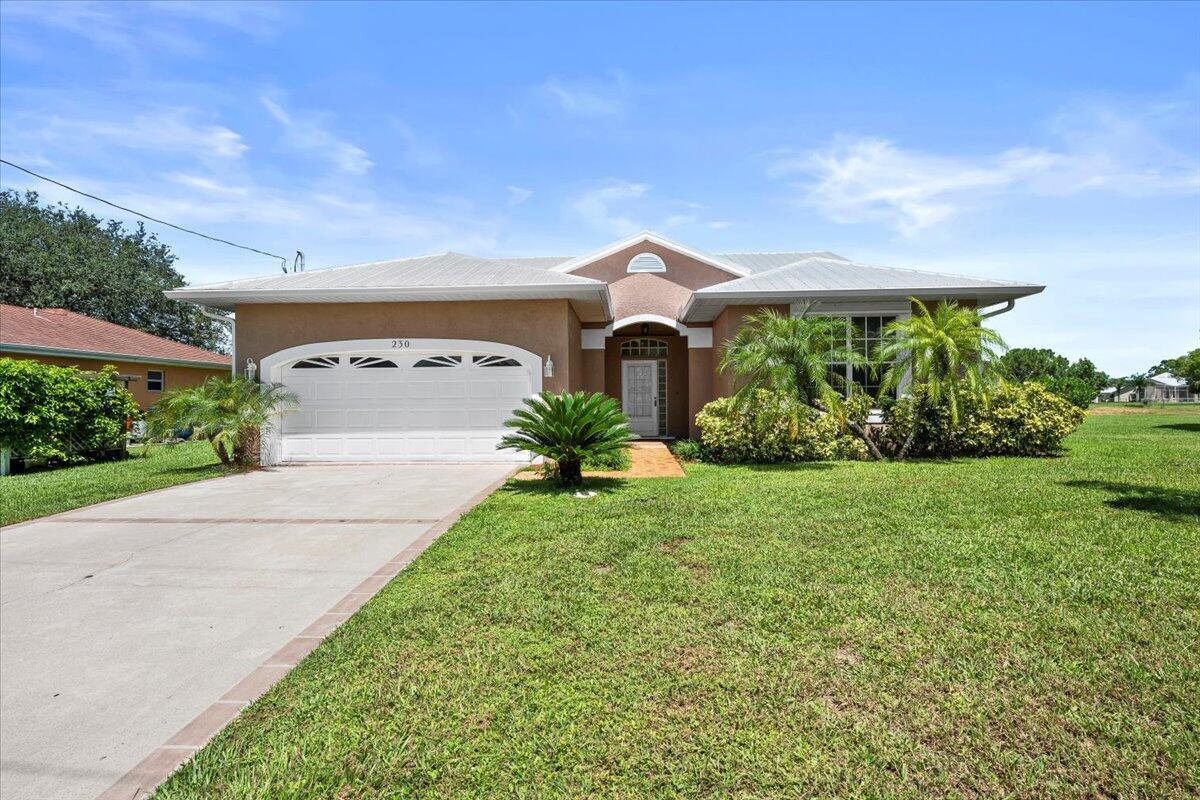 Lovely 3 Bedroom 2 bath home located on a canal lot. NEW ROOF just installed in July 2025. Freshly painted interior and exterior. Lushly landscaped, large eat in kitchen, solid wood cabinetry, granite countertops and volume ceilings. All living areas are tiled throughout. Luxurious primary bath with large soaking tub. Screened in patio with private pool. This home includes one lot (33) as the lots have been separated and documentation will be updated soon.