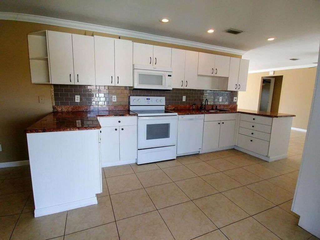 Photo of 925 SE Albatross Avenue, Port Saint Lucie, FL 34983 (MLS # R11109550)