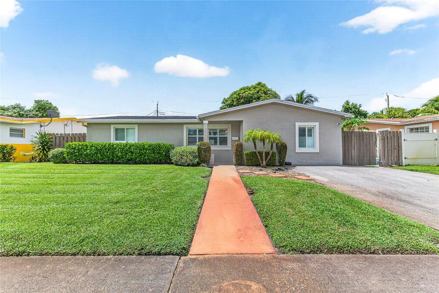 Here's your opportunity to own an affordable, beautifully upgraded home in a fantastic community! This spacious 3-bedroom, 2-bath residence offers a perfect blend of comfort and style. Enjoy the durability and elegance of impact windows and a front door, all enhanced with stylish plantation shutters throughout. The high-end tile floors create a sleek, modern look across the entire home.  The renovated kitchen features premium countertops and appliances, making it ideal for family gatherings and entertaining. The oversized room off the dining area provides versatile space—perfect for an office, study, playroom, or even a man cave. With a 3-year-old roof and lush, professionally landscaped front yard, this home offers exceptional value! Don’t miss out - schedule your showing today!