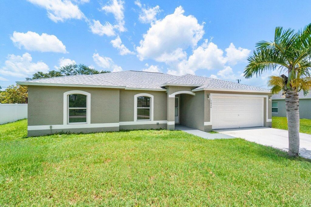 Photo of 1634 SW Cycle Street, Port Saint Lucie, FL 34953 (MLS # R10904432)