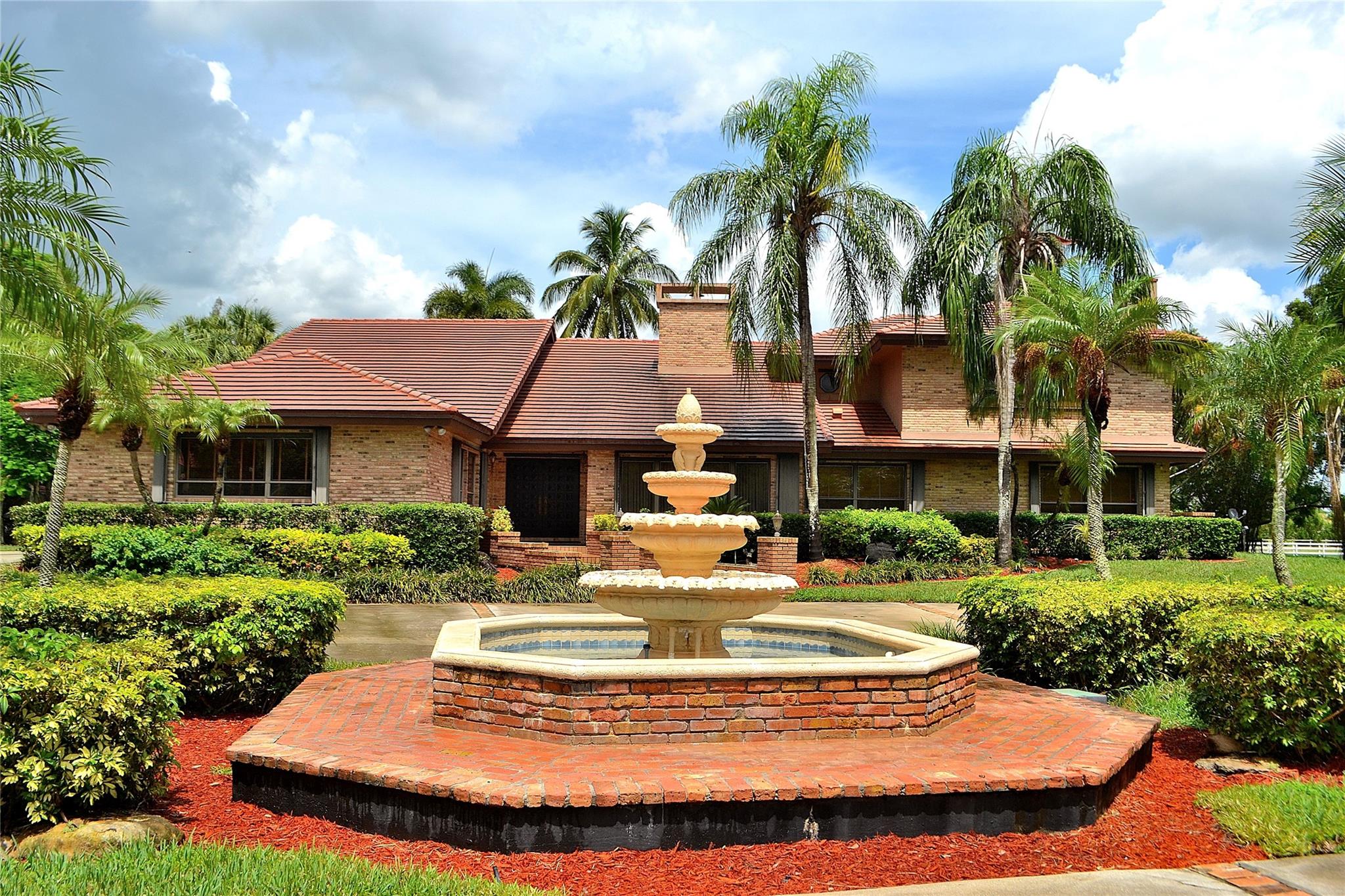 Don’t miss this one-of-a-kind majestic gated estate in sought-after Rolling Oaks, Southwest Ranches! This impressive 6-bedroom, 6-bath ranch-style home with high volume ceilings, sits on 5 beautifully maintained acres and offers the ultimate in privacy, space, and lifestyle. Enjoy the spectacular tropical resort pool and patio area, and a large gazebo—perfect for entertaining! The property also includes a professionally built CBS stables with two upstairs apartments—a 2 bed/1 bath and a 1 bed/1 bath—ideal for guests or staff. Whether you're looking to entertain, relax, or live the equestrian lifestyle, this palatial estate has it all. A rare opportunity—schedule your private tour today!
