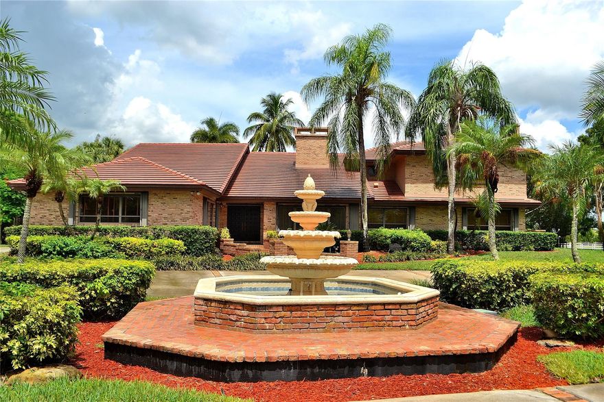 Don’t miss this one-of-a-kind majestic gated estate in sought-after Rolling Oaks, Southwest Ranches! This impressive 6-bedroom, 6-bath ranch-style home with high volume ceilings, sits on 5 beautifully maintained acres and offers the ultimate in privacy, space, and lifestyle. Enjoy the spectacular tropical resort pool and patio area, and a large gazebo—perfect for entertaining! The property also includes a professionally built CBS stables with two upstairs apartments—a 2 bed/1 bath and a 1 bed/1 bath—ideal for guests or staff. Whether you're looking to entertain, relax, or live the equestrian lifestyle, this palatial estate has it all. A rare opportunity—schedule your private tour today!