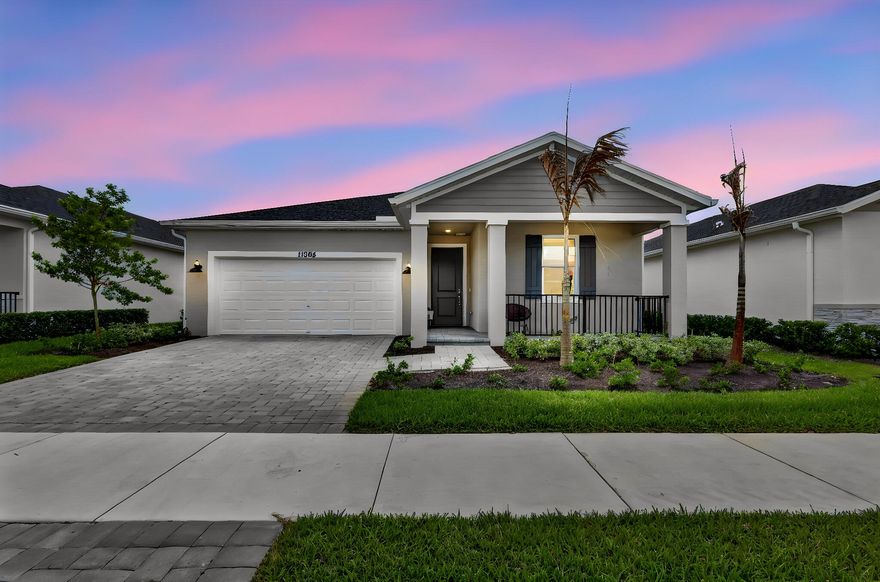 Welcome to this beautifully maintained one-story home in [Community Name], offering modern coastal-craftsman curb appeal, an open-concept layout, and a fully fenced backyard ready for entertaining. From the paver driveway and covered front porch to the elegant tray-ceiling primary suite, this home has been thoughtfully upgraded throughout. Step inside through the welcoming foyer to find soaring ceilings, large-format tile floors, and a sun-filled great room that flows seamlessly into the gourmet kitchen and dining area. The kitchen is the true centerpiece — featuring crisp white shaker cabinetry, granite countertops, a full stainless steel appliance package, a walk-in pantry, and an oversized center island with seating for four.  Sliding glass doors off the dining area open to a covered paver patio overlooking a generous, fully fenced backyard with no rear neighbors directly on top of you — ideal for South Florida outdoor living. The private primary suite is tucked away from the secondary bedrooms and offers a tray ceiling, dual windows, a spa-style en-suite bath with a dual granite vanity, frameless walk-in shower, private water closet, and a spacious walk-in closet. Two additional bedrooms share a full guest bath with granite counters and a tub/shower combo. A dedicated indoor laundry room and 2-car garage round out the floor plan.