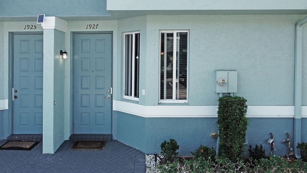 Photo of 1927 Hibiscus Lane, West Palm Beach, FL 33404 (MLS # R10972111)