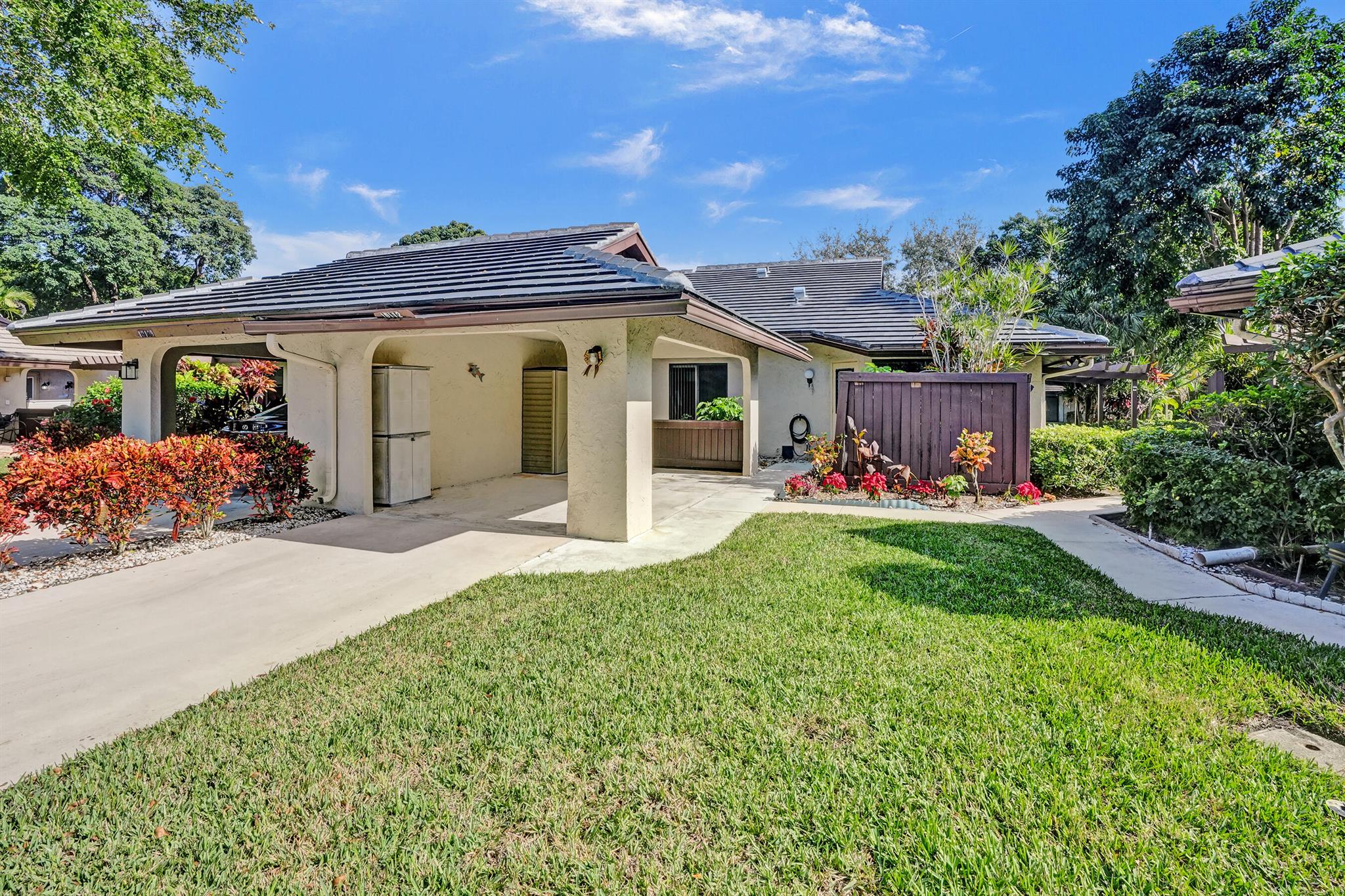 Public Remarks: CORNER PATIO VILLA AT BANYAN SPRINGS! Discover your dream home in this updated luxury corner patio villa boasting an impressive 1632 square feet of elegant living space- that includes the 232 square foot Florida Room with a southeast exposure and has sliding glass door access from the master bedroom and living room. Plus there's a new 2024 cement tile roof, a 260 square foot carport and 3-ton 14 seer AC system to keep you comfortable year- round. The 195 square foot modern eat-in kitchen features Doormark high gloss cabinetry and granite countertops. The villa also features 18'' x 18'' tile in kitchen and living areas, 72'' x 3.75'' Eco-Forest mocha locking bamboo plank flooring in both bedrooms and 18'' x 18'' Castille Aran II porcelain tile in the Florida room.