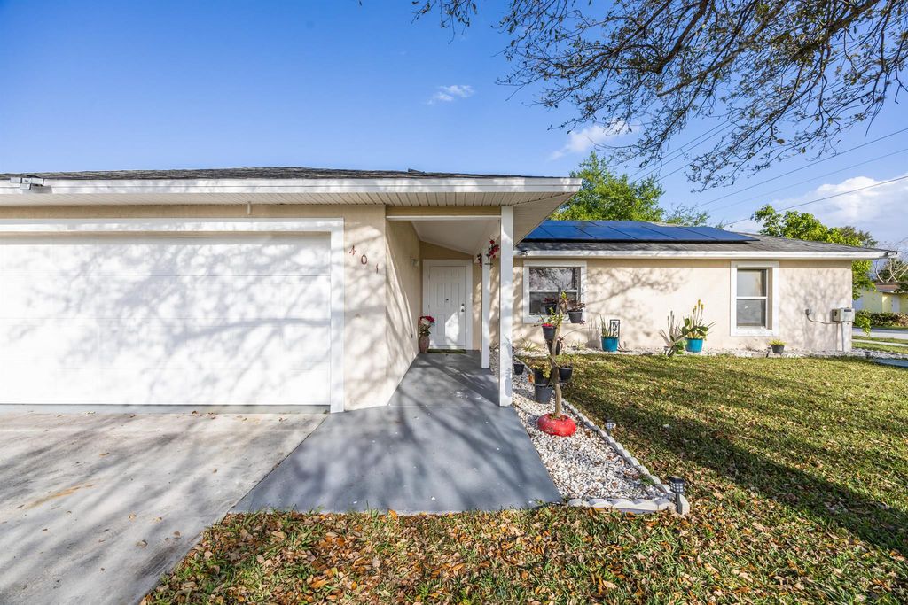 Photo of 401 NE Mainsel Street, Port Saint Lucie, FL 34983 (MLS # R11090445)