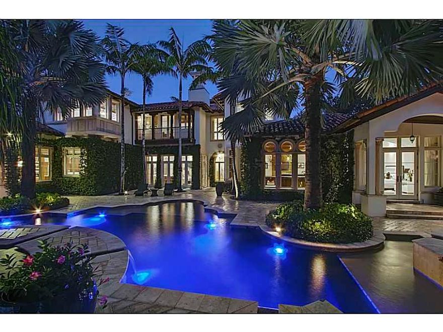 Venetian inspired Italian estate boasts 6 bedrooms, 6 baths, 2 half baths, 3 fireplaces & 3.5 car garage + 1 car showcase.  A ground floor master suite, architectural ceilings, gourmet kitchen & billiard lounge only begin to exemplify unique design elemen ts.  The resort lakefront pool with sunken bar, spa and outdoor kitchen are surrounded by mature specimen vegetation. Positioned in the exclusive gated Windmill Ranch Estates this architectural masterpiece welcomes entertaining & gracious living..