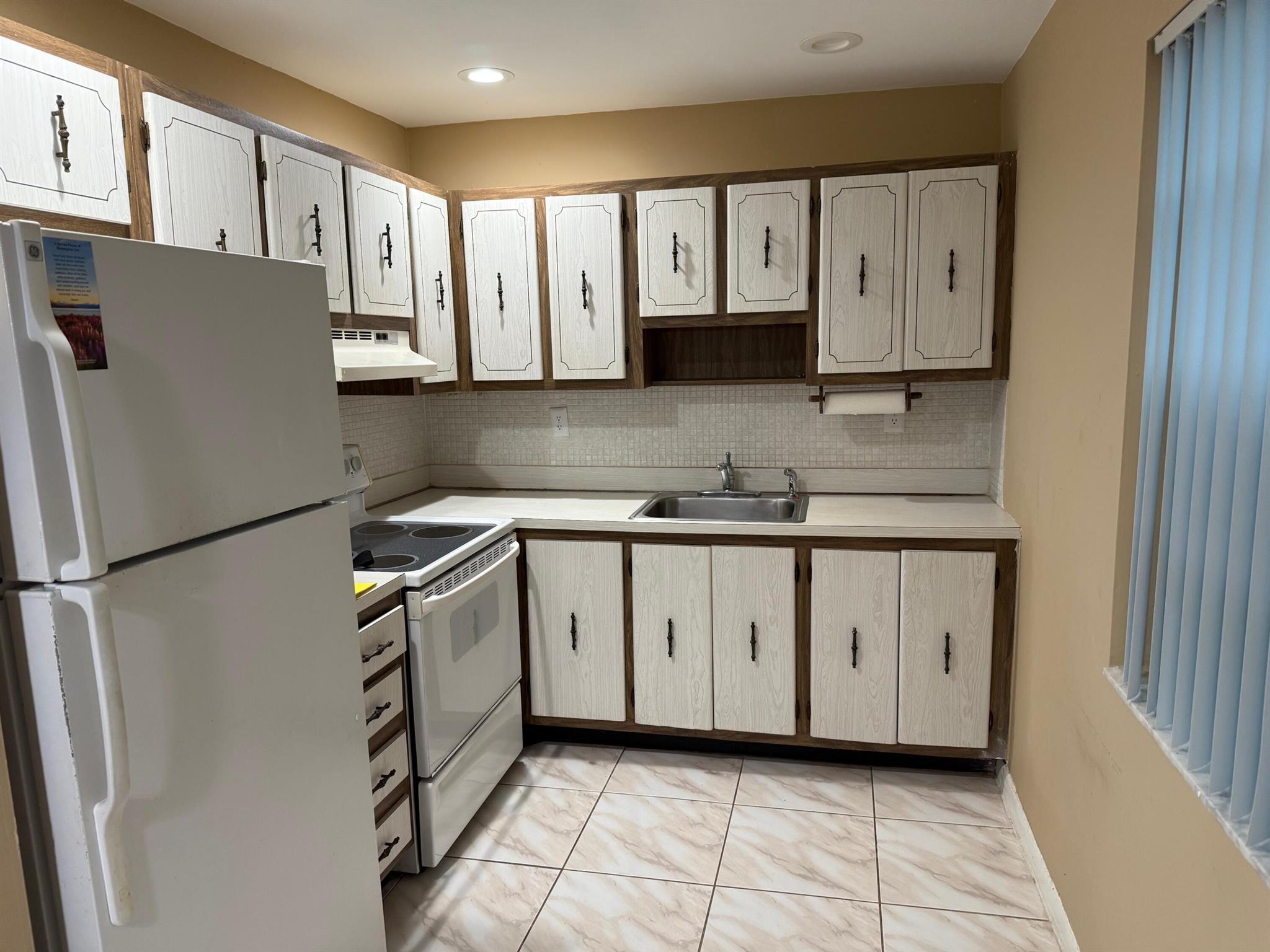BUY and RENT IMMEDIATELY!A great opportunity for rental investment or inexpensive living. 2 bedrooms, 2 bathrooms in a 55+ community. Tiled throughout with enclosed patio, washer and dryer. Great views of clubhouse, golf course and walk to the pool.