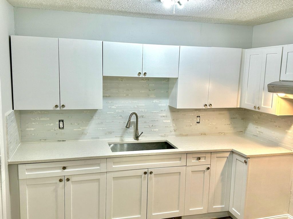 Photo of 1472 W 32nd Street, Riviera Beach, FL 33404 (MLS # R10996519)