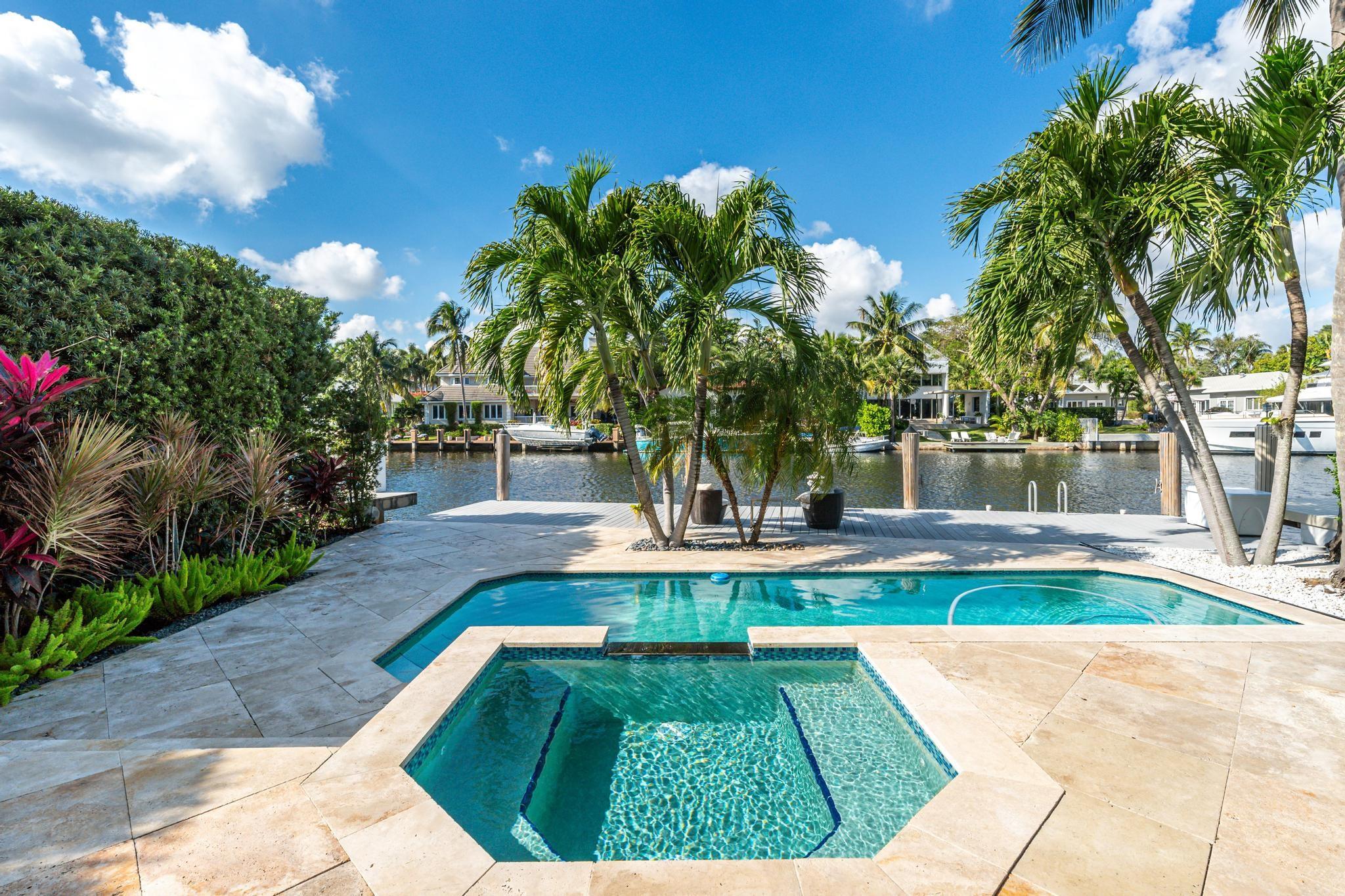 Exquisite modern home on 55 ft of private waterfront, steps from Las Olas Blvd and the beach. The 1st floor of this newer built property features a foyer, a gourmet kitchen equipped with a gas range, sub zero appliances, opened to the dining and living areas as well as a guest bedroom and full bath. The 2nd floor includes an open den area, a massive primary suite with a private balcony overlooking the water, an on-suite primary spa, 2 additional bedrooms with a "jack-and-jill" bathroom, and a laundry room. Floor to ceiling impact windows throughout the home. The outdoor becomes an extension to the main living area with its expansive terrace, heated pool and hot spa. A private dock with utilities can accomodate a 45' yacht.