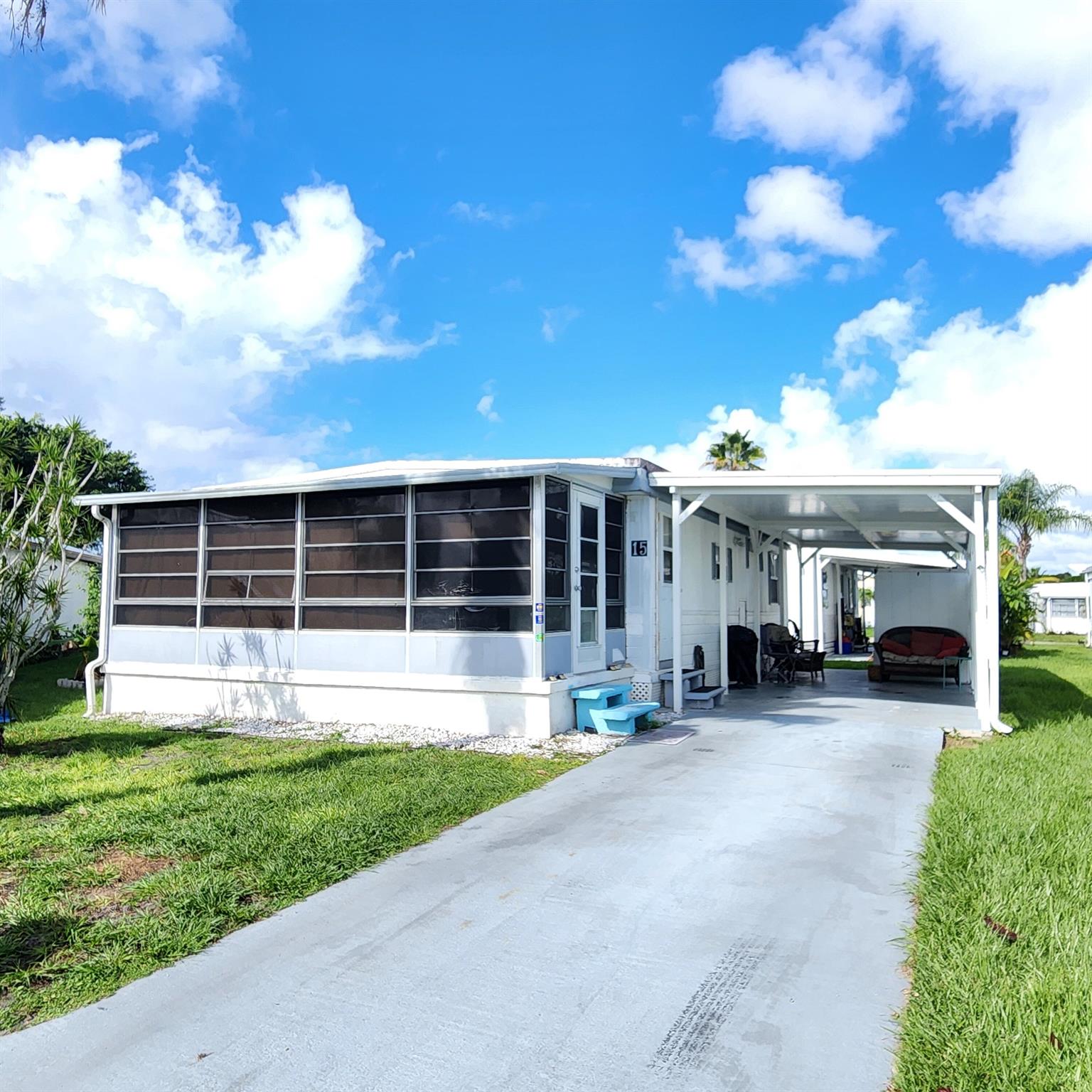 Charming 2 bedroom/1.5 bathroom on a cul-de-sac. Furnished home with a large Florida room perfect for a home office, 2nd living room, pet or plant room!! AC is 2022 and roof was sealed/coated in 2022. Living room & guest bedroom flooring replaced.  Most notable is this home is nestled in a peacefully quiet, yet active, 55+ community. You will be pleased w/ this prime location; close to the beach, mall, grocery stores, shopping, post office, banks, pharmacies, hospitals & more. Lot lease of only 842.53 includes security, cafe, Clubhouse w/activities, lawn care, trash, free private golf course, bingo, heated pool, pickleball, tennis, workshop, shuffleboard, bocce, gym, library, cards, Mahjong, clubs & more! Grab your slice of paradise in the highly desired town of Port St Lucie!