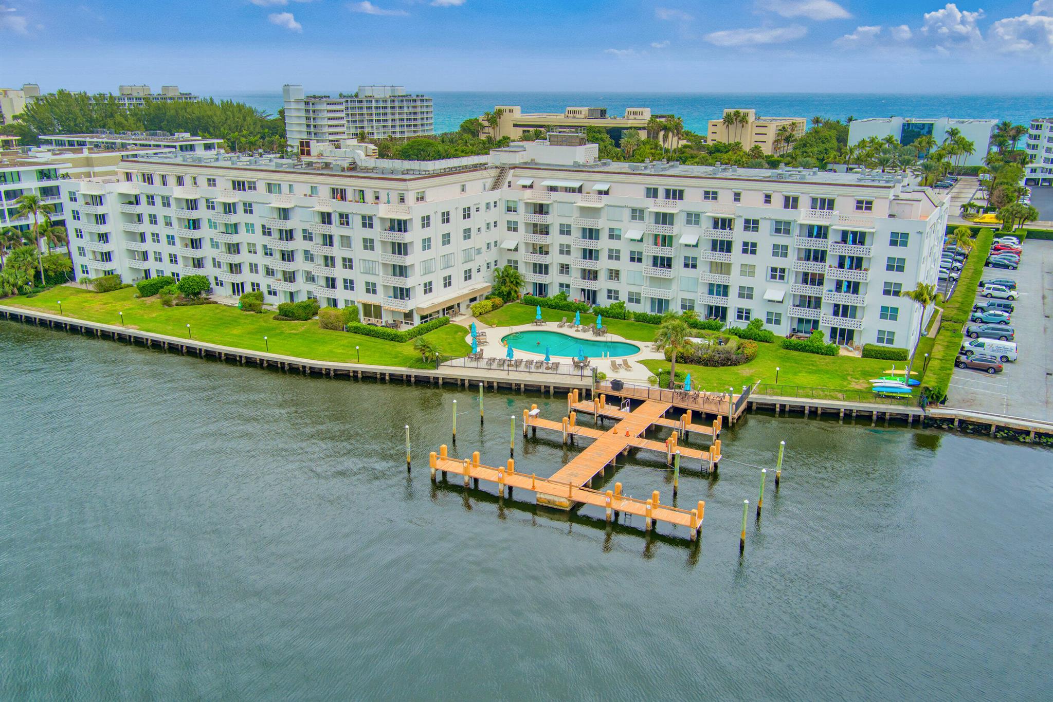 Lovely east-facing unit on the 4th floor with views to the ocean. Enjoy your breakfast on the balcony and your evenings by the heated pool overlooking the sunset on Intracoastal Waterway. Fully furnished, mid-century modern style, with neutrals throughout. New stainless steel appliances. New Water Heater. Updated electricals. Available January through April. Full services include building manager, 24/7 door person and maintenance staff. Community room with WiFi, computer and printer. Gym and dock available for boats up to 32'. Laundry on each floor. Coop board approval required. Assigned parking.