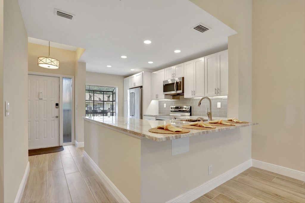 Photo of 1945 SW 15th Street #68, Deerfield Beach, FL 33442 (MLS # B26017308)