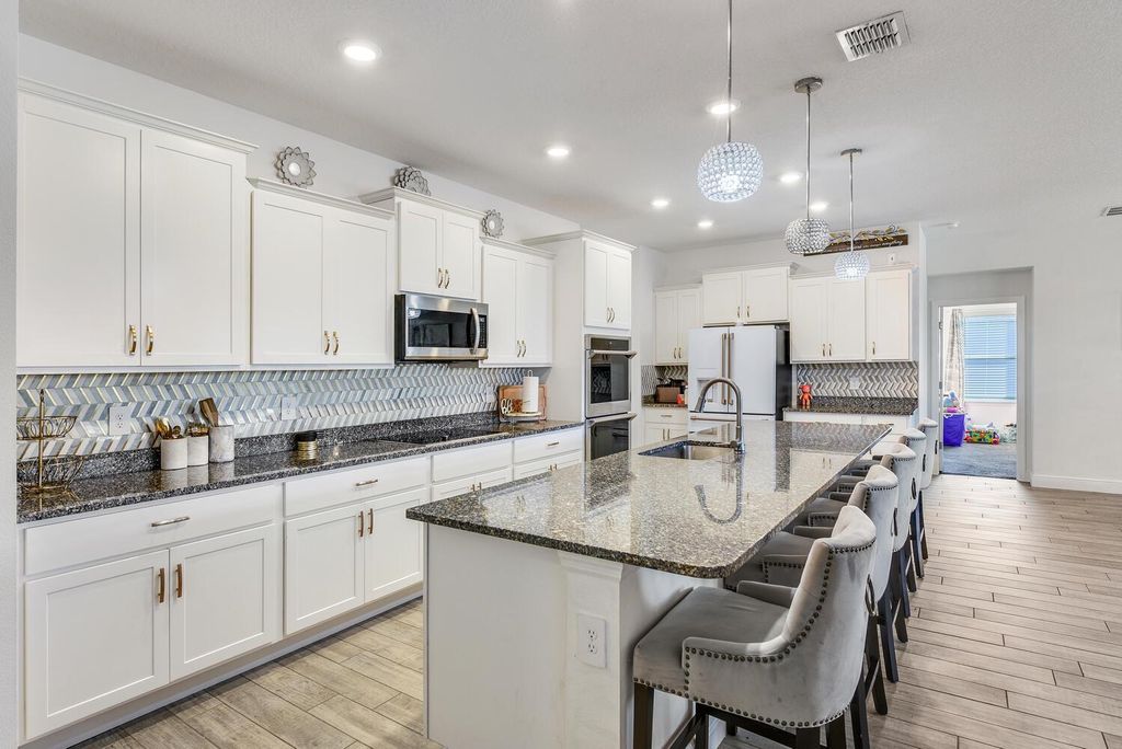 Photo of 643 SW Millard Drive, Port Saint Lucie, FL 34953 (MLS # R11144053)