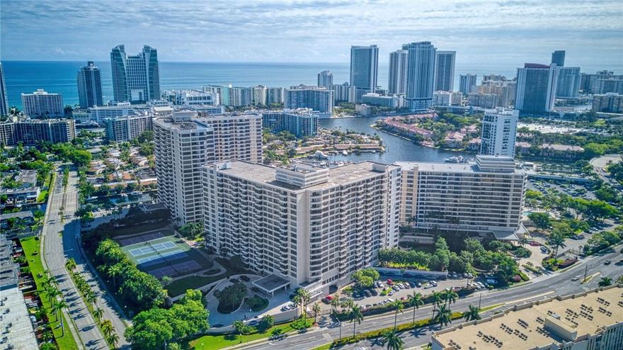 1.5% Concession offered toward closing costs for full asking price of $385,000. Amazing 2 Bed/2 Bath condo with alluring kitchen. Spacious living/dining room combo with beautiful and serene garden views. Large Master Suite with walk in closet and bathroom. Huge Balcony overlooking peaceful courtyard. Private, Gated community in Three Islands with resort like features such as 2 heated pools, Self Car Wash, Game Room, Library, 4 BBQ's, 5 new tennis courts, state of the art gym with Sauna and Yoga. 24 hour on site security with surveillance. Assigned parking space in attached garage and valet. Minutes from Hollywood beach, restaurants, Gulfstream and located between Fort Lauderdale and Miami. CAN BE RENTED IMMEDIATELY AFTER PURCHASE. SPECIAL ASSESSMENT HAS BEEN PAID! A must see!