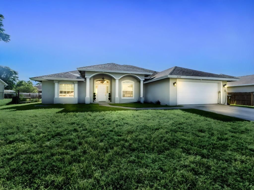 Photo of 4417 SW Idlewild Street, Port Saint Lucie, FL 34953 (MLS # R11114819)