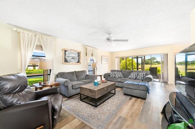 Welcome to luxury and comfort with this fully furnished a exceptional turn-key 2 bedroom, 2-bathroom condo ready for you to call home. Nestled within the exclusive and secure Meadowood Community and ideally located steps away from the community pool and stunning views of the 17th fairway of a championship golf course. The open and airy floor plan is ideal for entertaining and the outdoor lanai with new screen enclosure installed in 2023. This unit comes with brand new washer/dryer (2023), brand new AC and rooftop compressor (2023), new living room furniture (2023).