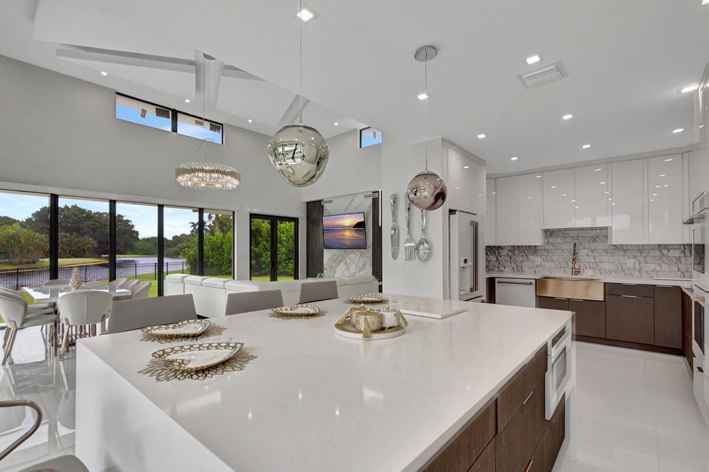 Photo of 10385 Avenida Del Rio, Delray Beach, FL 33446 (MLS # B26083116)
