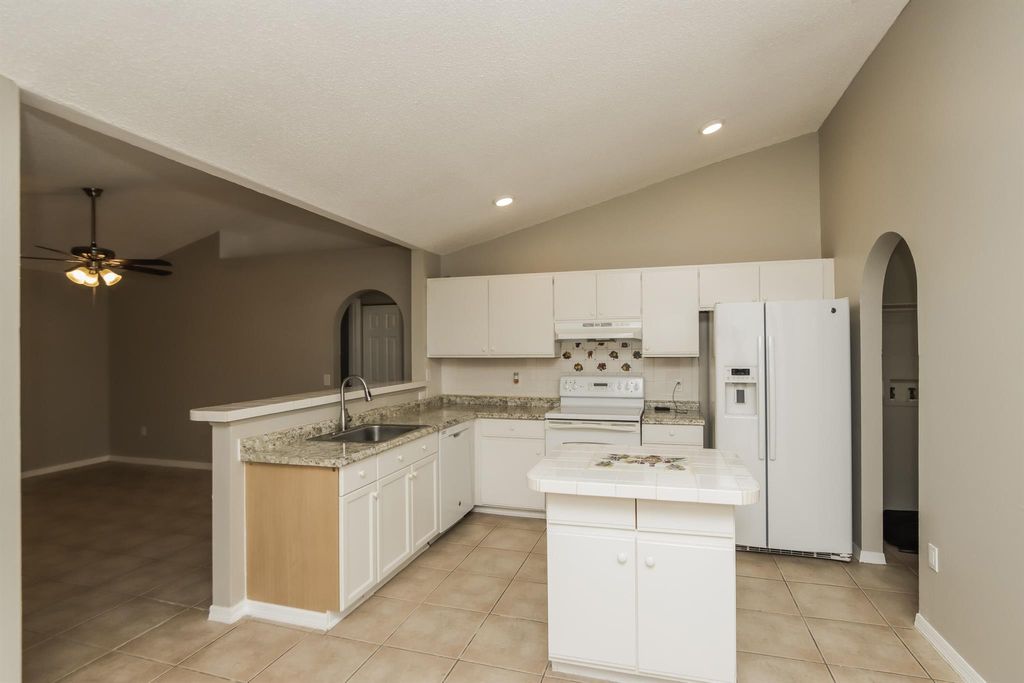 Photo of 371 SW Feldman Avenue, Port Saint Lucie, FL 34953 (MLS # R11108997)