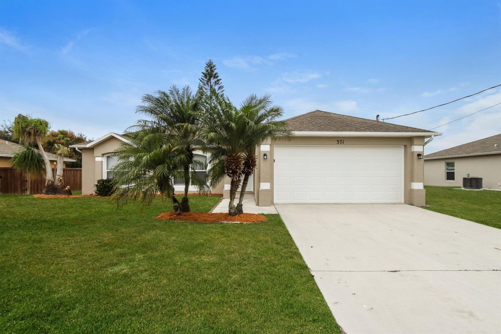 Photo of 371 SW Feldman Avenue, Port Saint Lucie, FL 34953 (MLS # R11108997)