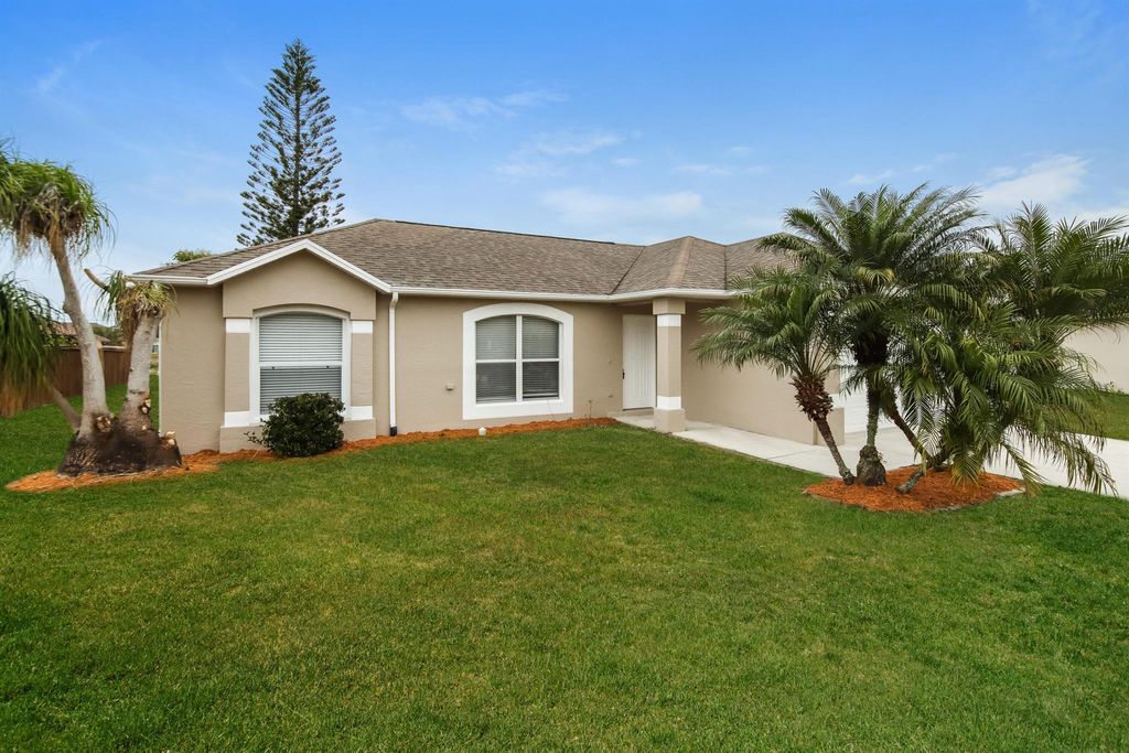 Photo of 371 SW Feldman Avenue, Port Saint Lucie, FL 34953 (MLS # R11108997)