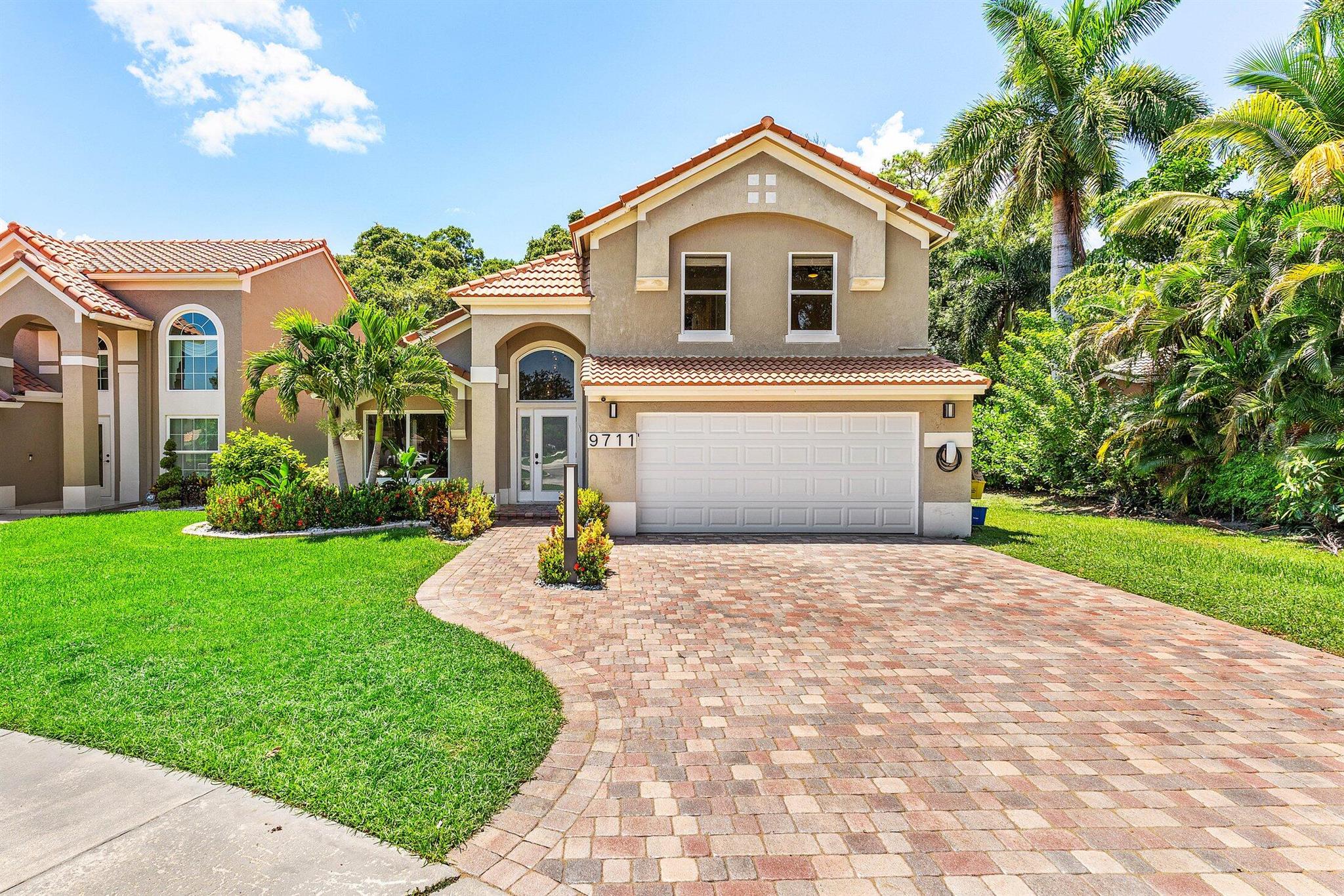 Homes like this don't come around often! Fully remodeled 2 story home tucked away in the beautiful Villaggio subdivision in Boca Raton. This property has been thoughtfully upgraded with full-home impact windows and doors, fully remodeled kitchen and bathrooms, with the primary suite conveniently located on the main floor. This home also has new flooring throughout, custom built-in closets, Tesla Level 2 EV Charging station, 2017 roof with close proximity to top-rated schools and a low HOA. This one checks every box! Schedule your private showing today.