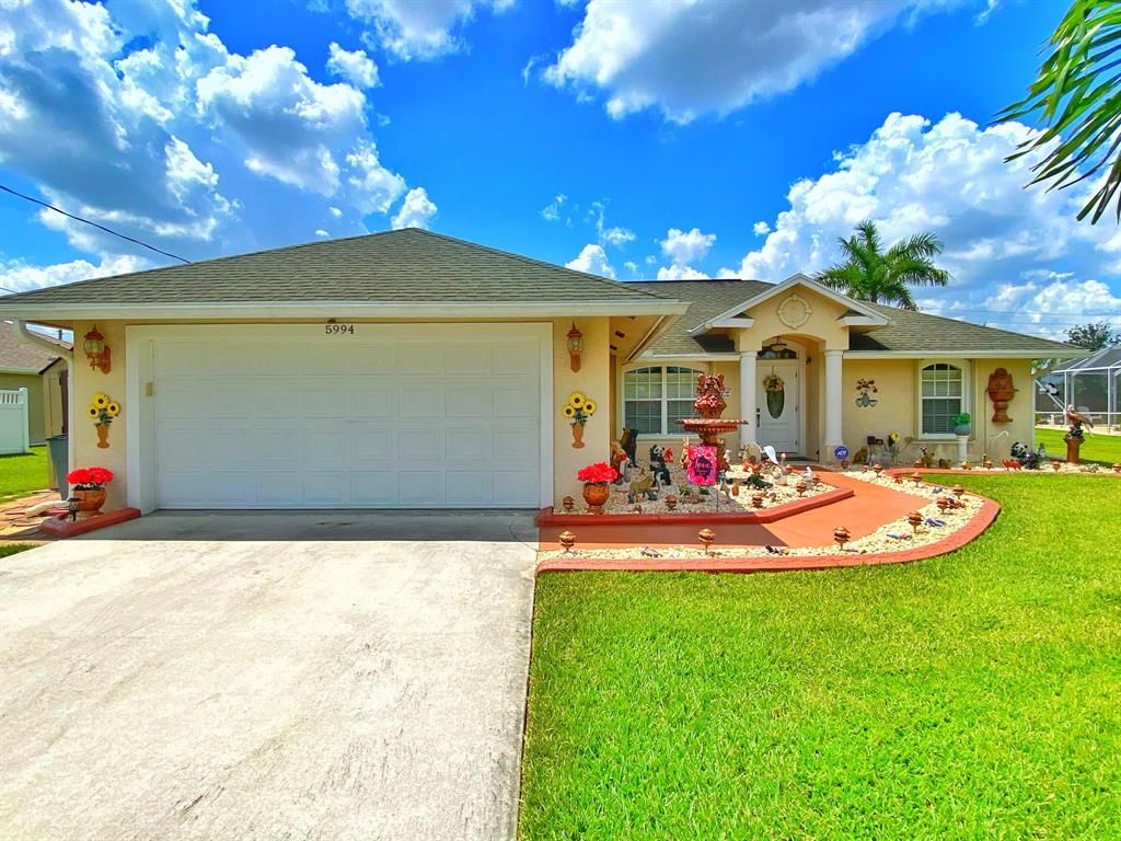 Photo of 5994 NW Wolverine Road, Port Saint Lucie, FL 34986 (MLS # R10713254)