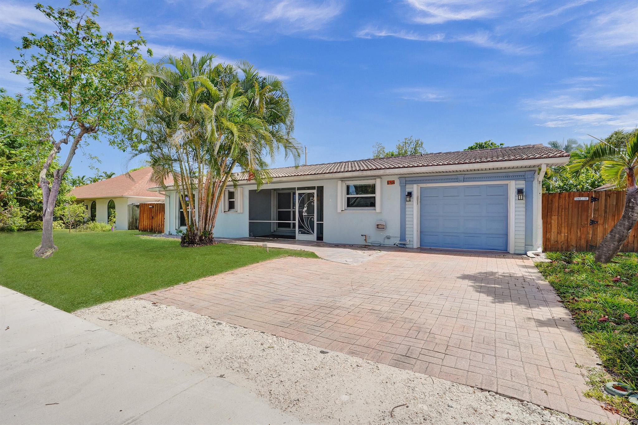 Beautiful 3 Bedroom, 3 Bath home just 1.5 mile from the beach. Features a bright, open layout w/ tile & laminate, LED lighting, fresh interior paint. Gray quartz countertops, breakfast bar, and gas stove. Updated bathrooms, brand-new A/C. Laundry area in the garage with gas dryer. Enjoy a spacious, fenced backyard complete with an outdoor shower. Top location just minutes from Whole Foods, Publix, Trader Joe's, Target, Home Depot, and only half a mile from I-95.