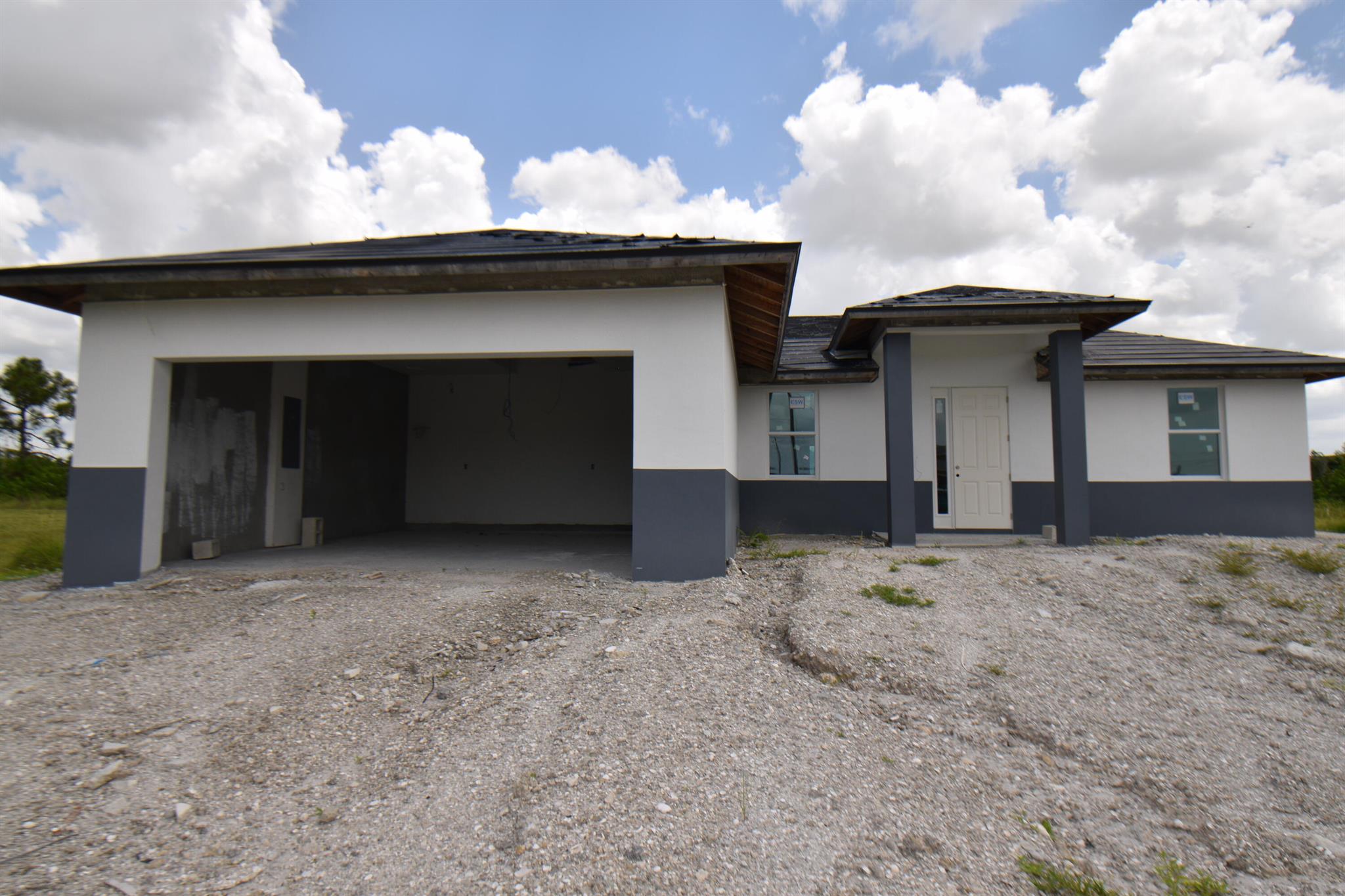 Under Construction, the Estimated Completion Date is December 2024. This POOL home features 4 bedrooms, 2 baths, and a 2 CAR garage. Total area 2,888 sq/ft living area sq/ft 1,658. CBS Block walls with stucco finish. Aluminum framed Impact glass and Low E windows, Tile throughout the house. 2 car garage with pavers driveway and walkways. Fiberglass exterior doors. QUARTZ throughout brushed nickel hardware, and Upgraded appliance package with refrigerator stove/oven and microwave. The kitchen comes backsplash with tiles Walls are 9'4'' tall. Private Pool 28x12 And much more... PICTURES ON MLS ARE TO DISPLAY THE HOME WHEN READY AND BUILD AND DO NOT REPRESENT THE CURRENT CONDITIONS OF THE CONSTRUCTION