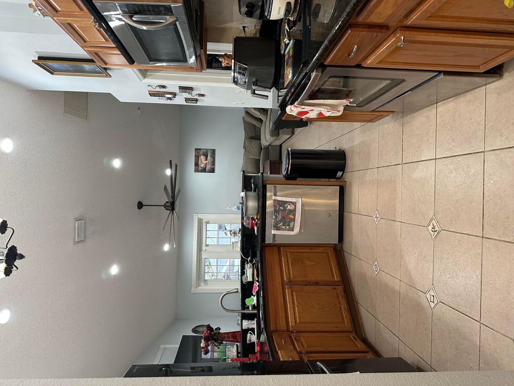 Photo of 1481 SW Dow Lane, Port Saint Lucie, FL 34953 (MLS # B26007023)