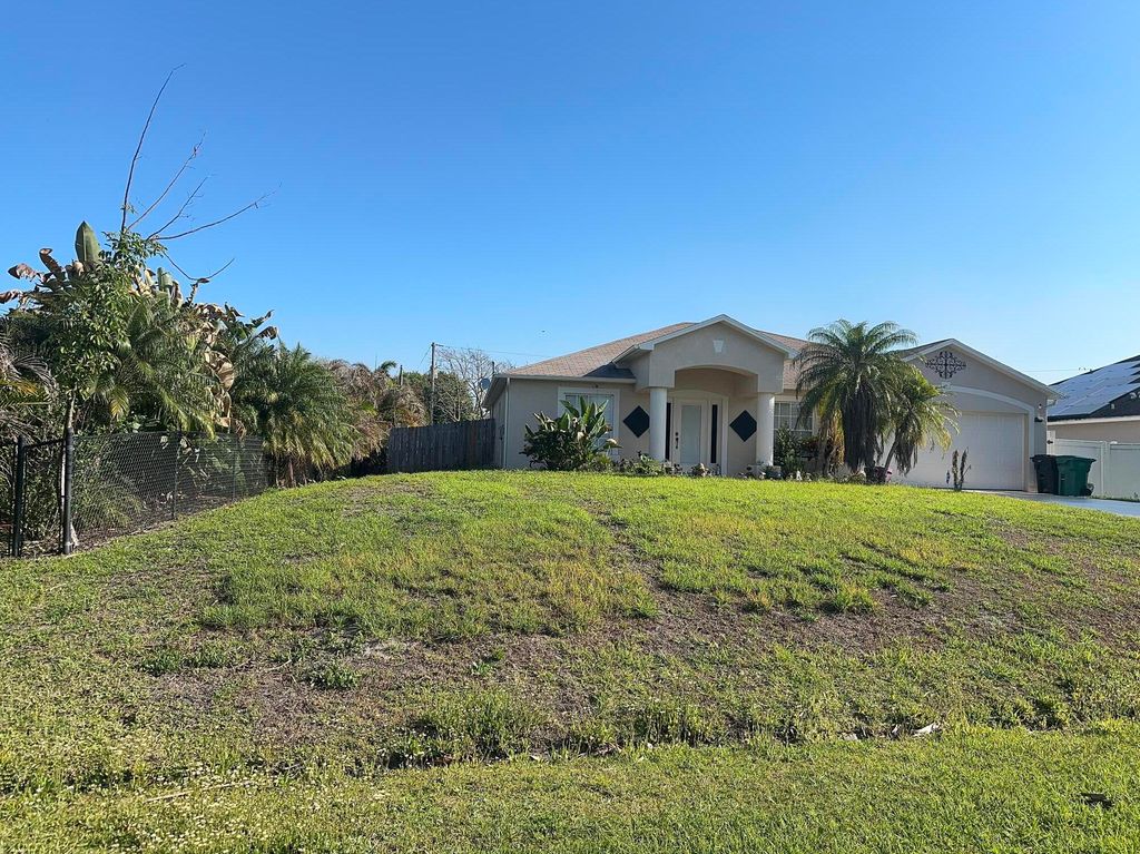 Photo of 1481 SW Dow Lane, Port Saint Lucie, FL 34953 (MLS # B26007023)