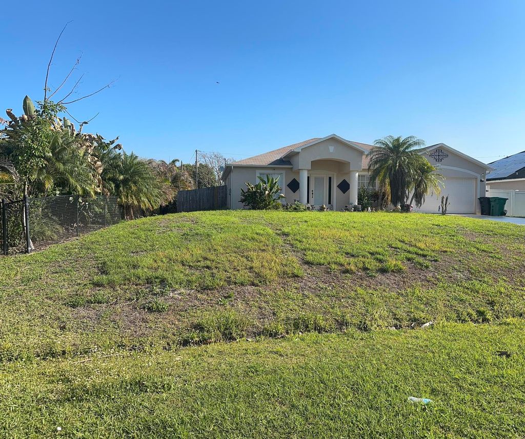 Photo of 1481 SW Dow Lane, Port Saint Lucie, FL 34953 (MLS # B26007023)