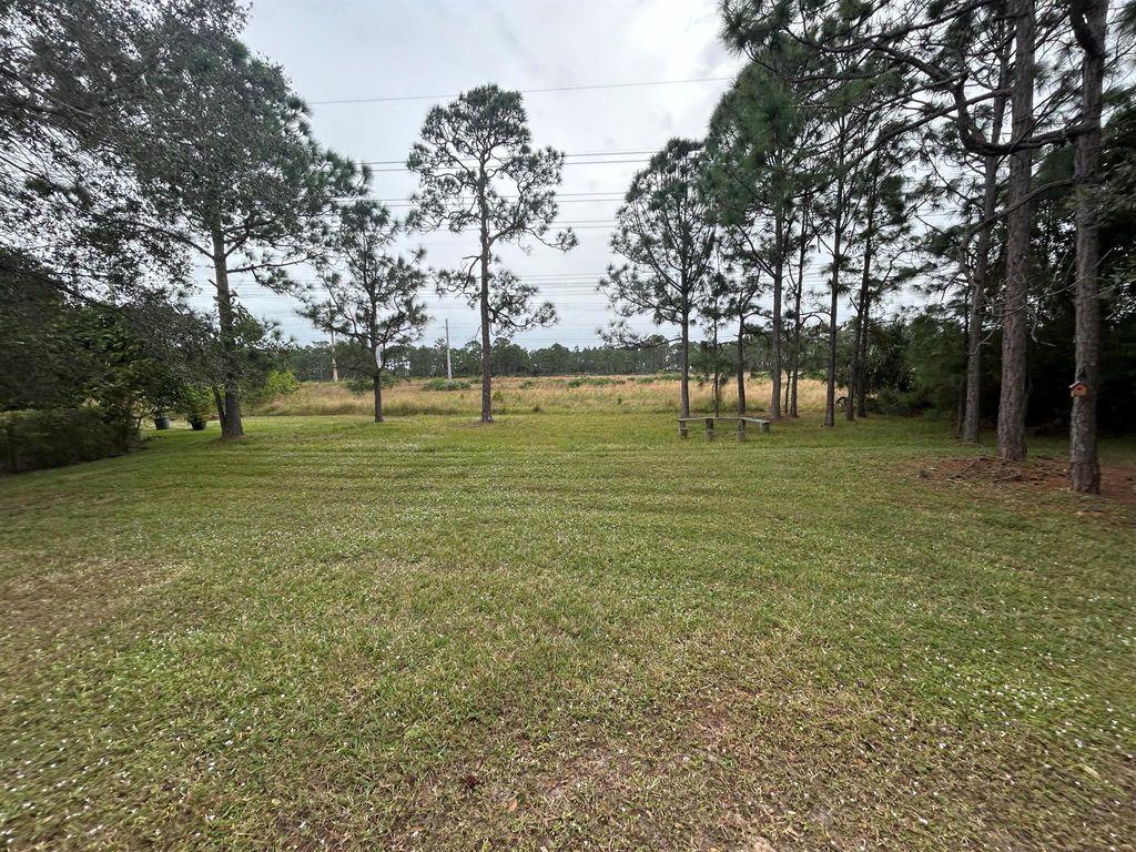 Photo of 5834 NW Windy Pines Lane, Port Saint Lucie, FL 34986 (MLS # R11084302)