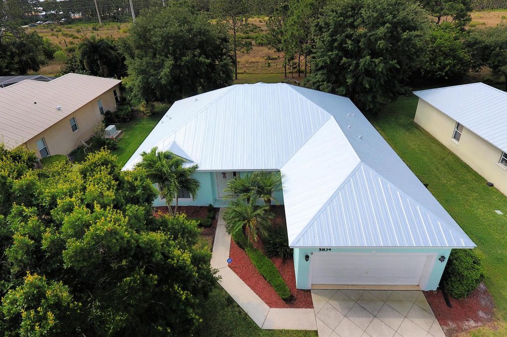 Photo of 5834 NW Windy Pines Lane, Port Saint Lucie, FL 34986 (MLS # R11084302)