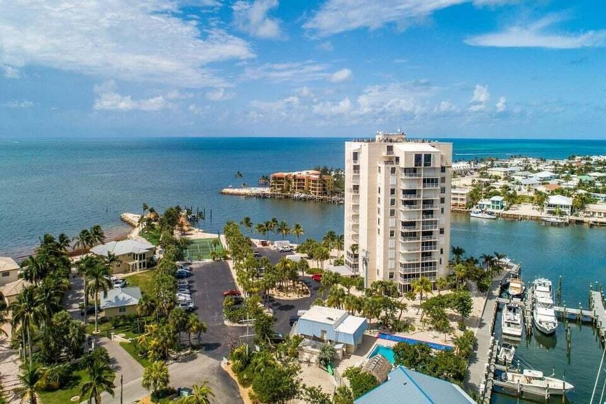 Welcome to the tallest building in the Florida Keys. This 6th floor unit provides stunning open water views, a large bedroom with a bathroom, two large walk in closets, and ample natural light. This complex has something for everyone. Tennis, pickleball, swimming, saunas, a gym, billiards, onsite management, fishing and ample parking. Don't miss your opportunity to call this stunning unit home.Fee Includes: Bldg Exterior Mnt; Building Insurance; Cable; Common Area Mnt; Exterminating; Security; Sewer; Water