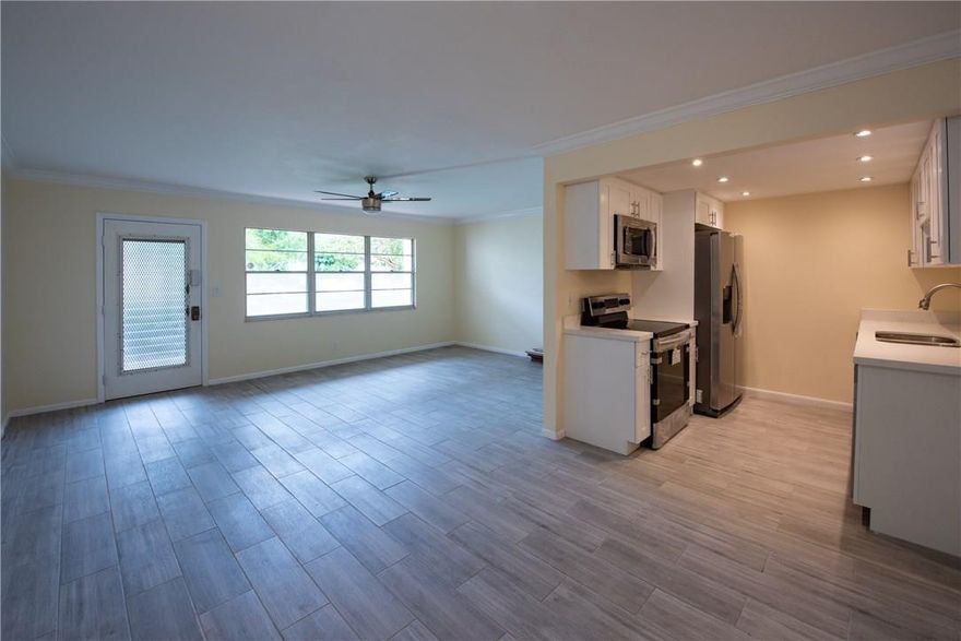 Don't miss this beautifully renovated 1 bedroom, 1.5 bath first floor unit in Wynmoor's Lucaya Village.  New ceramic tile flooring, new kitchen with SS appliances and new baths.  Walk out of your back patio to the pool area.  All renovations permitted and approved by Wynmoor and City of Coconut Creek.  Wynmoor is one of the best 55+ active lifestyle communities in the area with golf, tennis, movie theater, clubhouse, security and transportation.  Unit also has an excellent parking space.