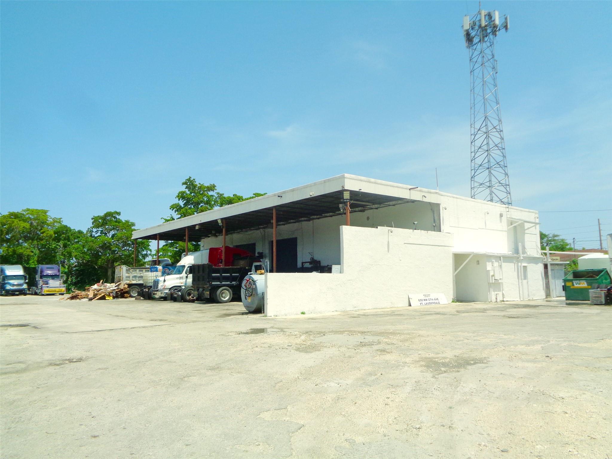 A private and secluded opportunity for businesses seeking a versatile lot in unincorporated Broward County. This 8,734+/- SQFT property is on 2.48 acres of land, zoned C-1 (Commercial Warehouse District), and renovated in 2023. It also comes equipped with a 2-story 3,364 SQFT office space and warehouse which is 2,720 SQFT, ensuring plenty of room for daily operations. The warehouse features 3 roll-up garage doors (14' W x 16' H) and a generous 20' clear ceiling height. The overhang is 2,680 +/- SQFT. Additionally: 2,000 gallon bio diesel and 5,000 gallon bio fuel tank permitted for use onsite. Price is for building and 22 parking spots. Full lot and fleet parking are available at a negotiable price.