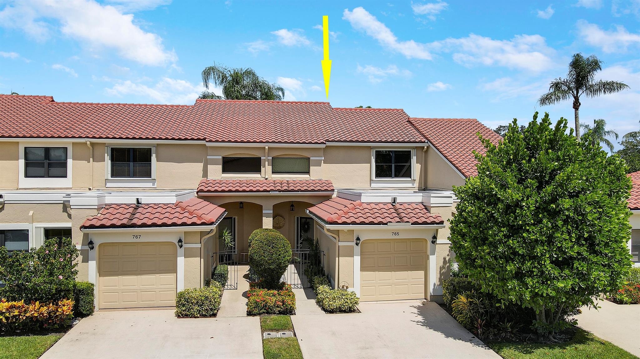 What a view! Located in Windermere at PGA National. Perfectly situated on the 3rd hole of the Palmer Golf Course. The home makes great use of space. Boasting 1909 SF of living space, Vaulted ceilings, 2 BR/ 2.5 BA and a loft that can be converted back to a 3rd bedroom, plus a 1 car garage. The roomy Primary suite is located on the 1st floor featuring a large walk-in closet as well as 2nd closet and a renovated primary bath with large soaker tub, seamless shower, updated vanity, tile and quartz counters. The kitchen features stainless steel appliances and breakfast nook area. Unlike other homes in Windermere, the laundry is located inside the home. Golf, Sports, Tennis and Social Memberships in PGA National are available and not mandated. This home is a must see! All sizes are approx.