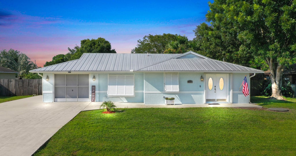Photo of 1141 SW Gastador Avenue, Port Saint Lucie, FL 34953 (MLS # R11021857)